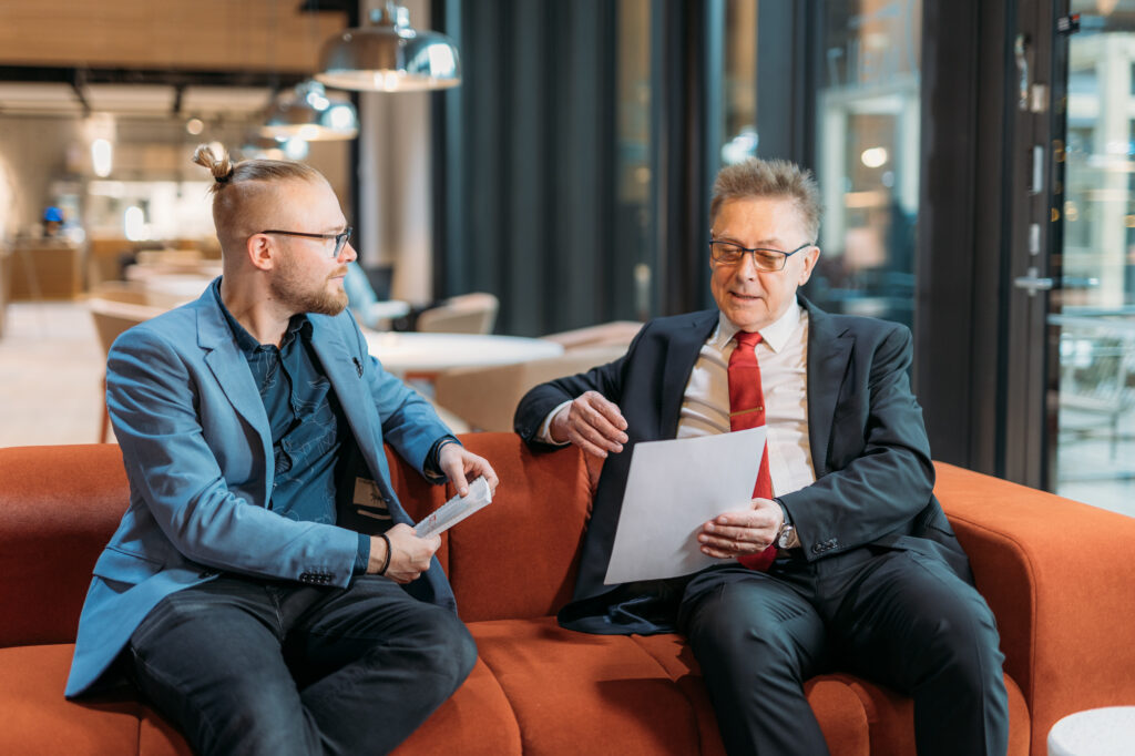 ICT DIRECT employees sit on the couch and talk